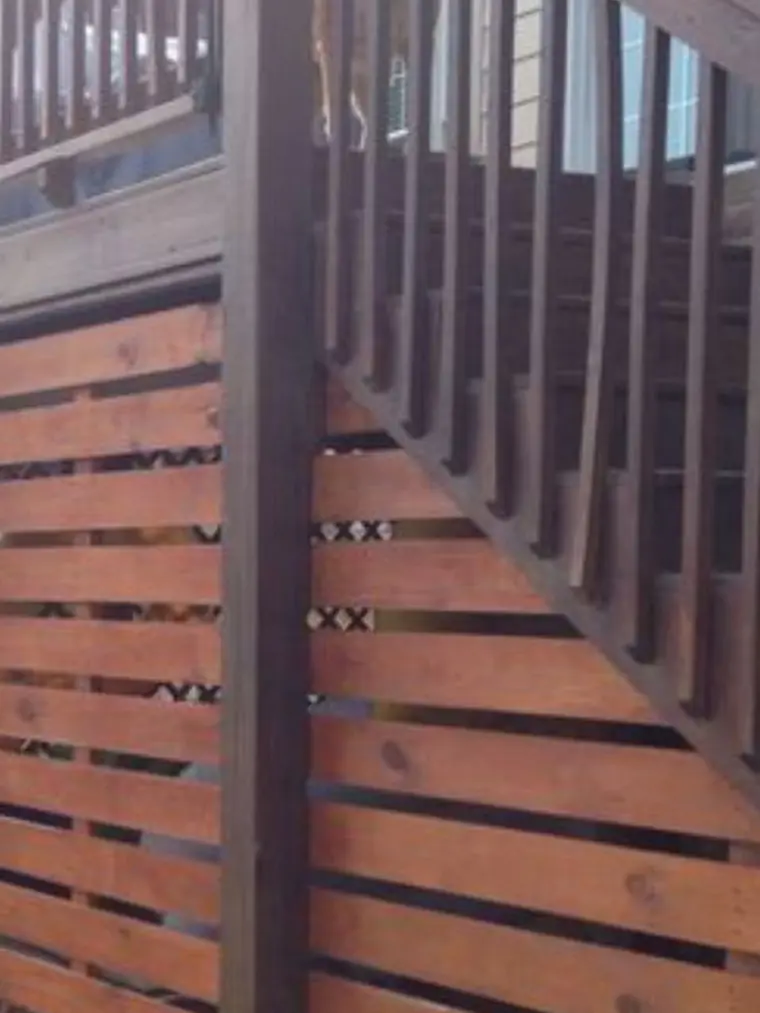 Horizontal wood slat railing on an exterior stair