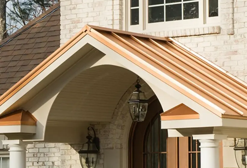 Home addition with a new covered entry and stone porch columns