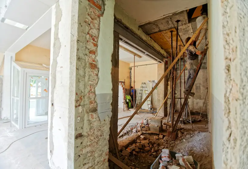 Home interior being dried and repaired after water damage